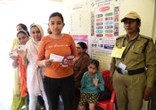 DEHRADUN, APR 19 (UNI):- Voters displaying identity cards while standing in the queue to cast their votes at a polling booth during the 1st Phase of General Elections-2024 at Barat Ghar Dandanda Raipur Dehradun, in Uttarakhand on Friday. UNI PHOTO-274U