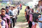 KANGPOKPI, APR 19 (UNI):- Voters standing in the queue to cast their votes at a polling booth during the 1st Phase of General Elections-2024 at Kangpokpi, in Manipur on Friday. UNI PHOTO-281U